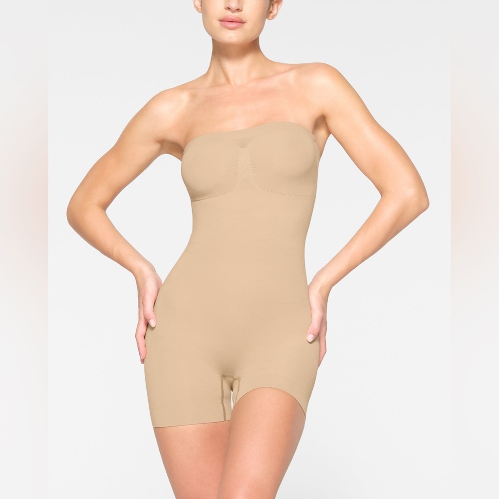 Skims body plunge mid thigh bodysuit in color tan  size small